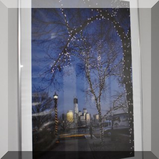 A13. Framed poster “City at Christmas Time”. 24”h x 17”w - $16